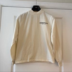 FOG - FEAR OF GOD KIDS 
Essentials Cream Long Sleeve T-Shirt